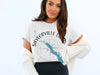 White t-shirt with "Saylorville Lake Iowa" text and compass graphic.