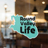 Teal sticker shaped like a map with black text "Round Valley Life" and copyright.