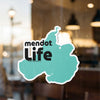 Turquoise sticker with black text "mendot LIFE" and copyright credit.