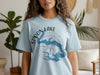 Light blue t-shirt with "Spoon Lake Illinois" and compass design.