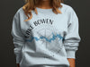 Light blue sweatshirt with "Lake Bowen South Carolina" text and a compass rose design.