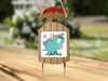 Christmas ornament shaped like a wooden sled with "Merry Christmas FROM Lake Perris".