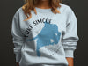 Light blue sweatshirt with Lake Simcoe Ontario map and compass design.
