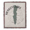 Woven blanket with Honeoye Lake shape, compass rose, and New York text.