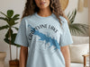 Light blue t-shirt with Grapevine Lake and Texas map design and compass graphic.