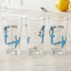 Three clear glasses with blue Medina Lake map and compass designs.