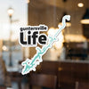 Guntersville Life sticker with turquoise lake outline near logo and copyright text.