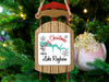 Sled ornament with "Merry Christmas from Lake Rayburn" text on Christmas tree.