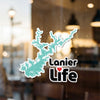 Turquoise lake outline sticker with "Lanier Life" and a red heart logo.