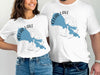 White t-shirts featuring a blue map of Clear Lake, California with a compass rose design.