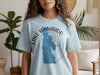 Light blue t-shirt with a blue graphic of Lake Wanahoo, Nebraska and a compass.
