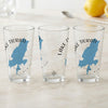 Three clear glasses with blue Lake Tiorati map designs and "New York" text.