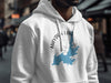 White hoodie with "Hayden Lake Idaho" text and a blue lake graphic.