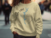 Light yellow crewneck sweatshirt with Lay Lake Alabama compass graphic and water detail.