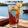Glass of iced tea with Lake Winnipeg map and "Lake Lodge Media" logo.