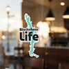 Blackshear Life sticker with lake outline and text on a glass surface.