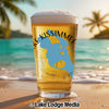Glass of beer with "Lake Kissimmee Florida" design on a beach.