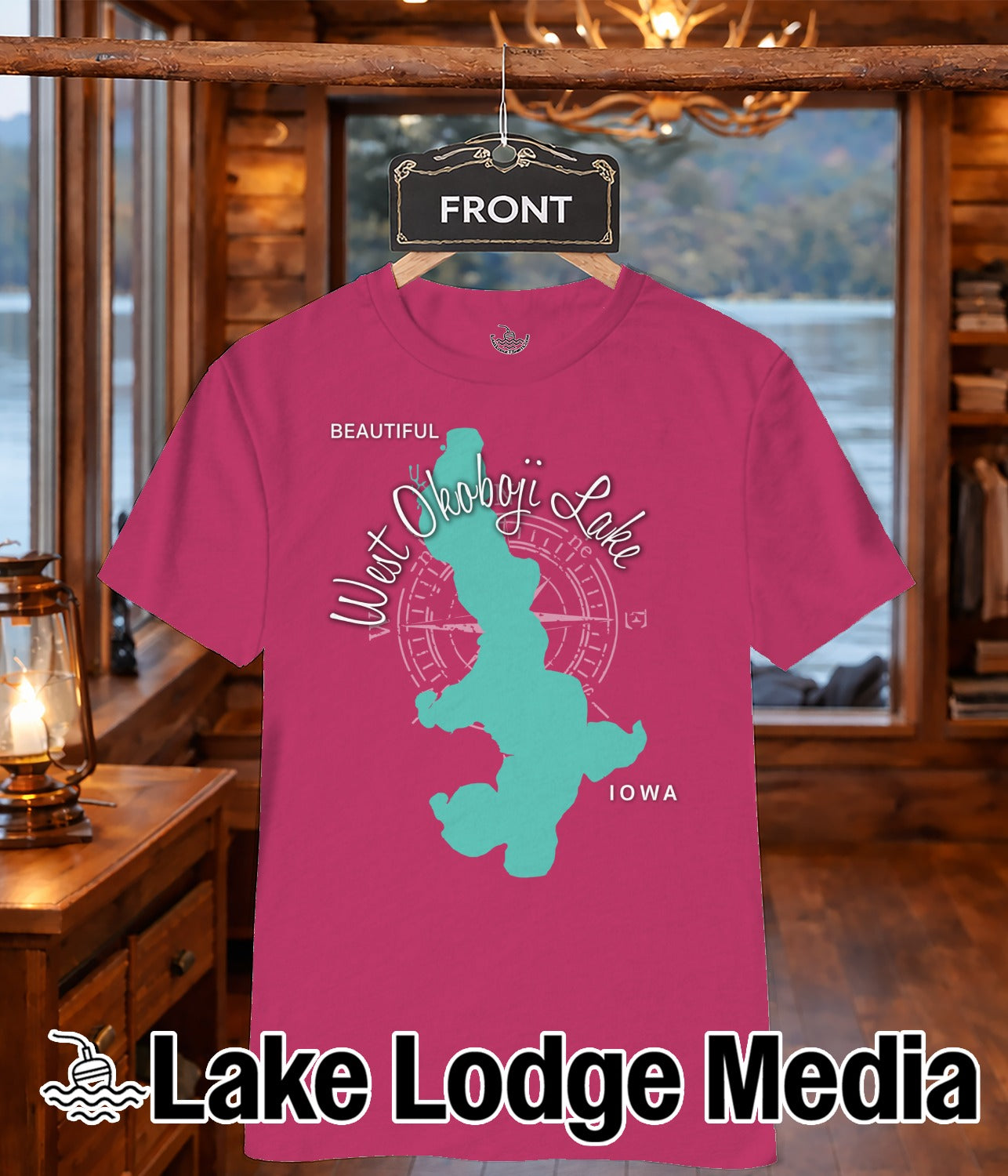 Pink t-shirt with turquoise West Okoboji Lake map graphic and "Lake Lodge Media" logo.