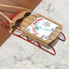 Wooden sled ornament with "Merry Christmas From Barrow River" text.
