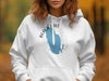 White hoodie with blue Black Lake New York map graphic and compass rose design.