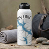White water bottle with map of Lake Lanier and compass, next to rolled towel and duffel bag.