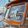 Barren River Life logo sticker and Lake Lodge Media text on a boat.