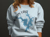Light blue sweatshirt with Badin Lake map and compass design, North Carolina text.