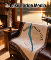 Woven blanket with Skaneateles Lake map and compass design.