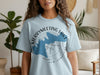 Light blue t-shirt with Merrymeeting Lake, New Hampshire graphic and compass design.