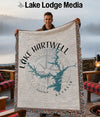 Lake Hartwell Georgia map and compass design woven blanket held by a smiling man.
