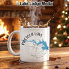 White mug with Pactola Lake map and compass design, steaming coffee.