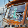 "Perry Life" decal on a boat window, with "Lake Lodge Media" text below.