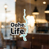 Oahe Life sticker with a teal outline of the lake's shape overlayed.