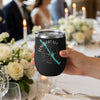 Black tumbler with Longboat Key silhouette and compass design, held by a hand.