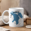 White mug with blue Lake Huron map design and compass rose.