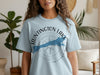 Light blue t-shirt with "Huntington Lake California" text and lake silhouette on a compass.