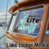 "Medina Life" sticker on a boat window with "Lake Lodge Media" logo below.