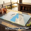 A rectangular tempered glass cutting board featuring a blue map of Lake Wanahoo, Nebraska with a compass design.