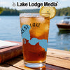 Glass of iced tea with lake outline graphic and "Forest Lake" text.