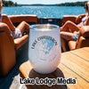 A white insulated wine tumbler with a Lake Charleston Ontario compass map design on a boat table.