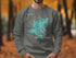 Grey sweatshirt with teal map graphic of Squam Lake, New Hampshire.