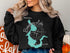 Black sweatshirt with "Broadway Lake, South Carolina" and compass graphic.