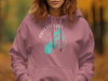 Pink hoodie with a turquoise Payette Lake map and compass design.