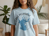Light blue t-shirt with "Lake Pleasant Arizona" text and compass graphic.