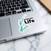 Smithville Life sticker with turquoise lake outline on laptop keyboard
