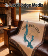Wallooon Lake map and compass design on a throw blanket.