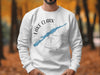 White sweatshirt on a man featuring Lake Clark, Alaska map overlay on compass graphic.