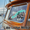"Marble Falls Life" sticker on a boat window, with "Lake Lodge Media" text.