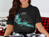 Rainy Lake Minnesota compass graphic on a black t-shirt.