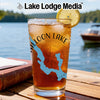 Glass with iced tea, lemon, and "Galloon Lake Michigan" graphic beside a book.